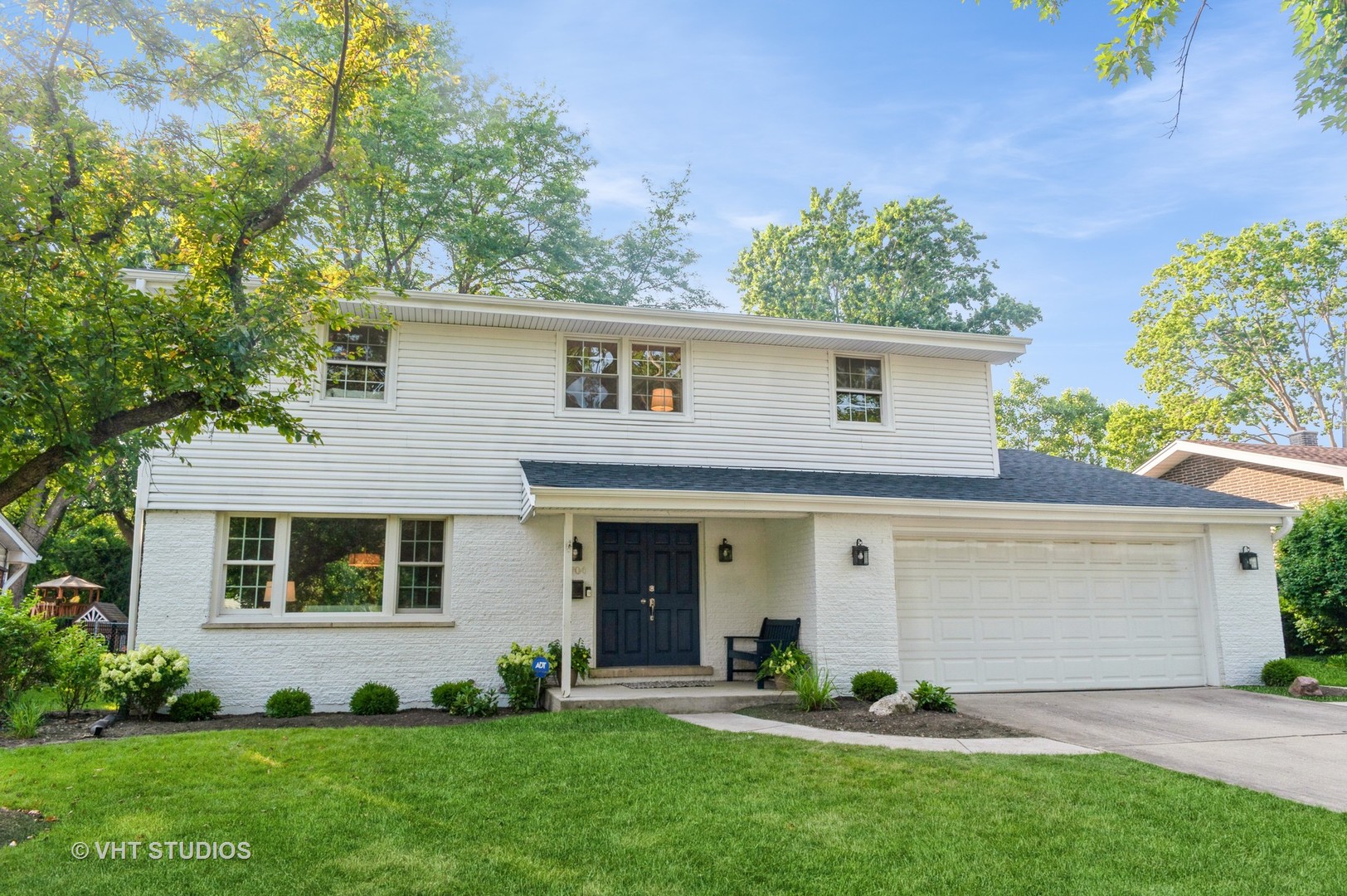 1704 Executive Lane Glenview, IL 60026 - Photo 2 of 21 a front view of a house with a yard and garage