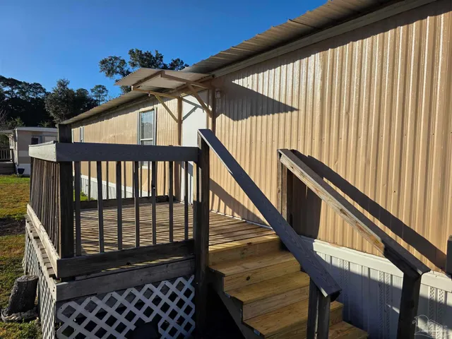 a view of balcony with wooden floor