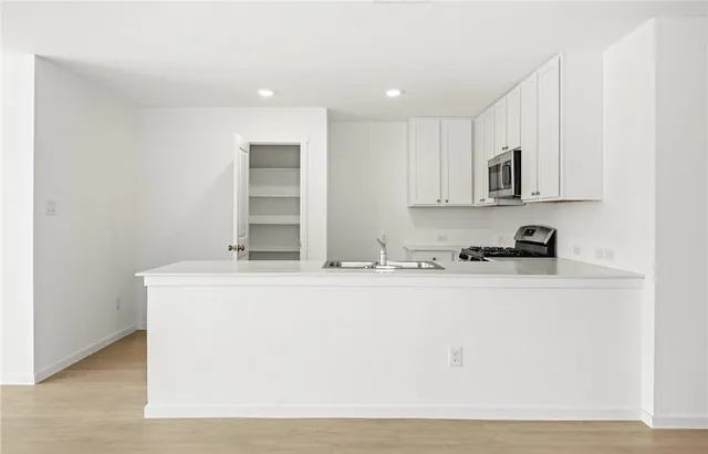 a view of kitchen with wooden floor