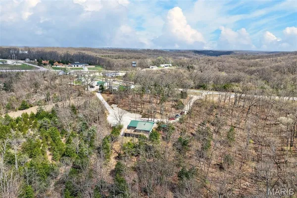 $325,000 | 89 Singing Oaks Drive, Sunrise Beach, MO 65079