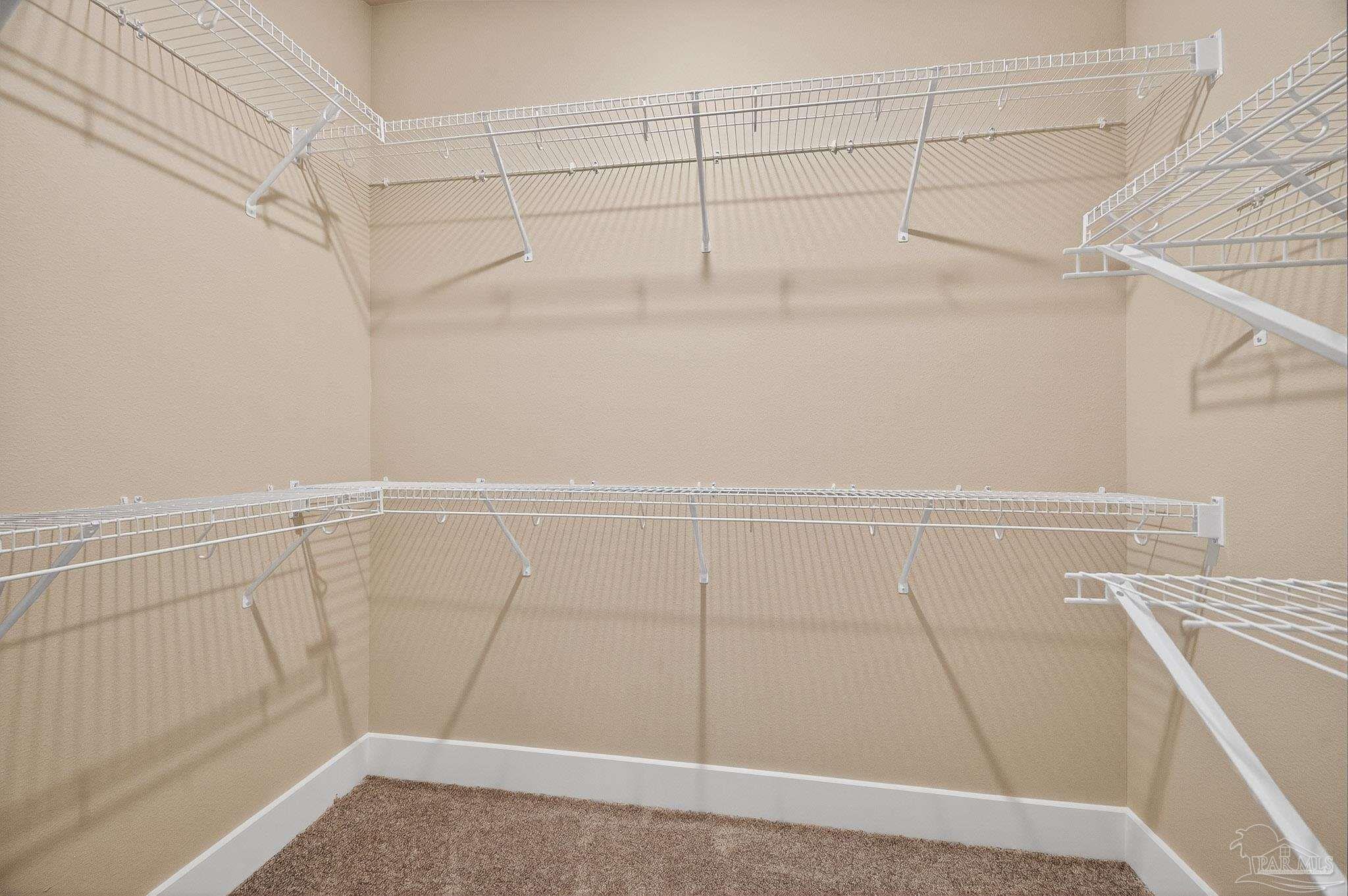 205 Webb Street Cantonment, FL 32533 - Photo 21 of 49 a view of a room with racks on the wall