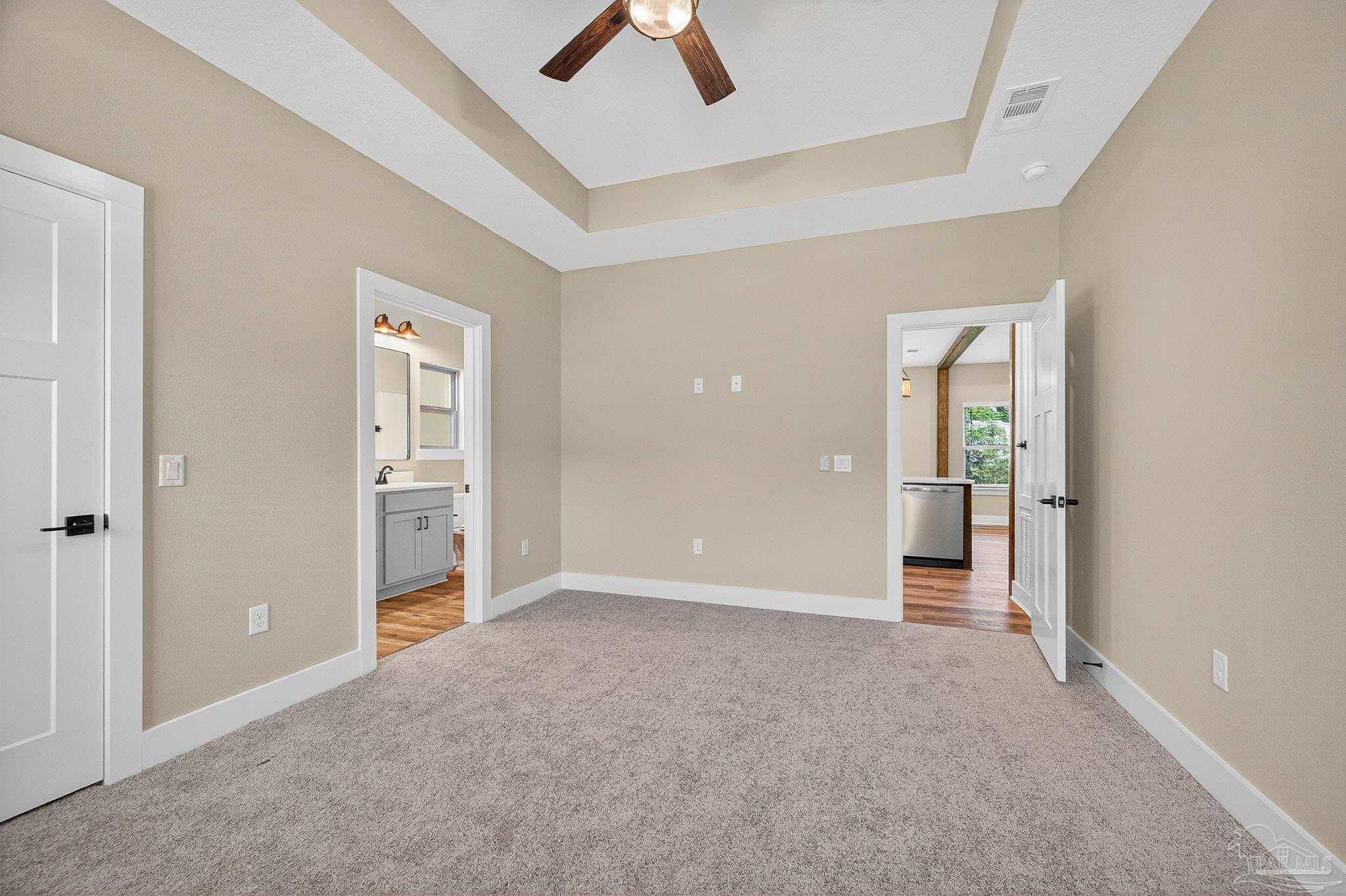 205 Webb Street Cantonment, FL 32533 - Photo 22 of 49 an empty room with closet and a ceiling fan