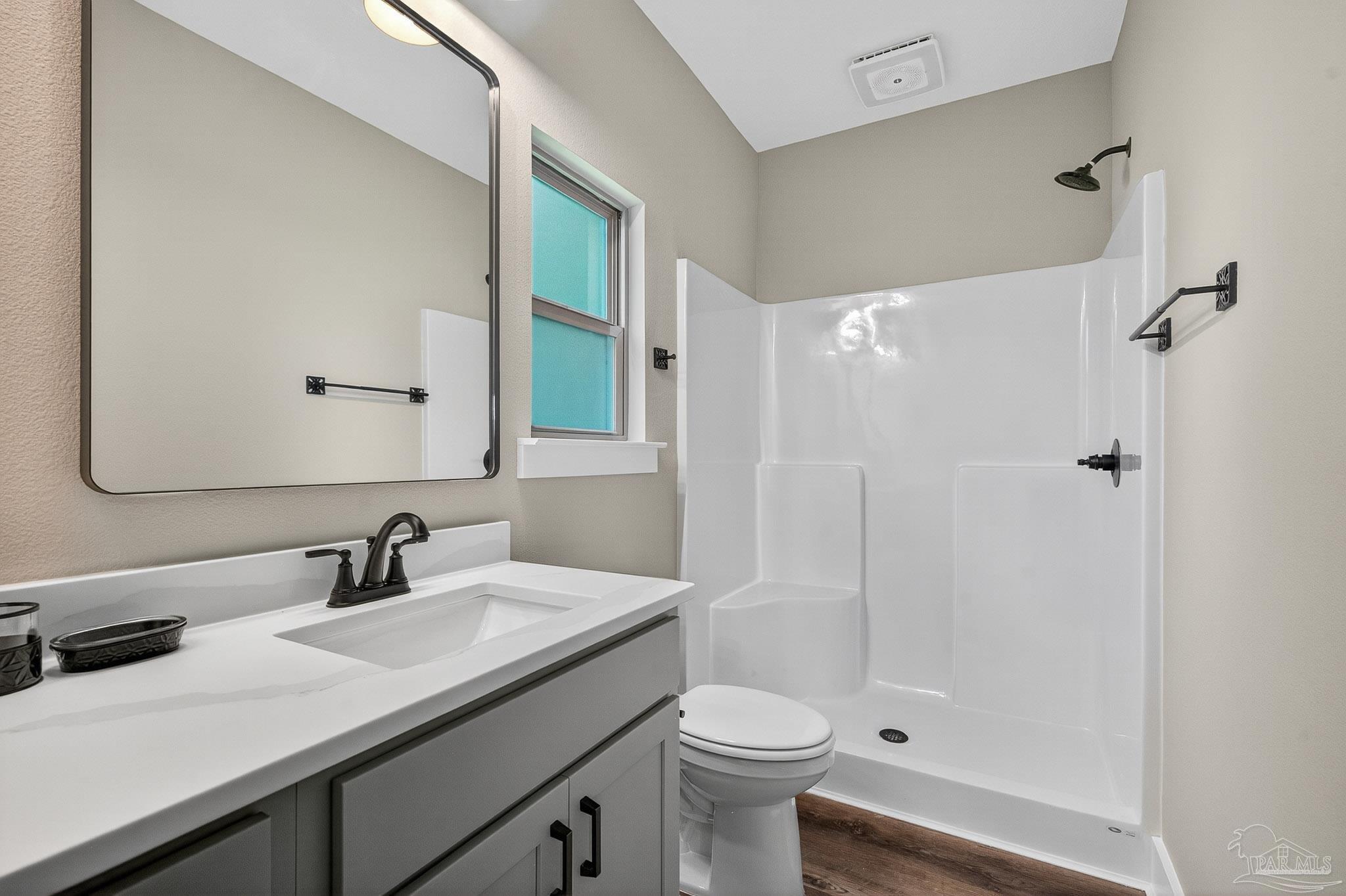 205 Webb Street Cantonment, FL 32533 - Photo 24 of 49 a bathroom with a sink a toilet and shower