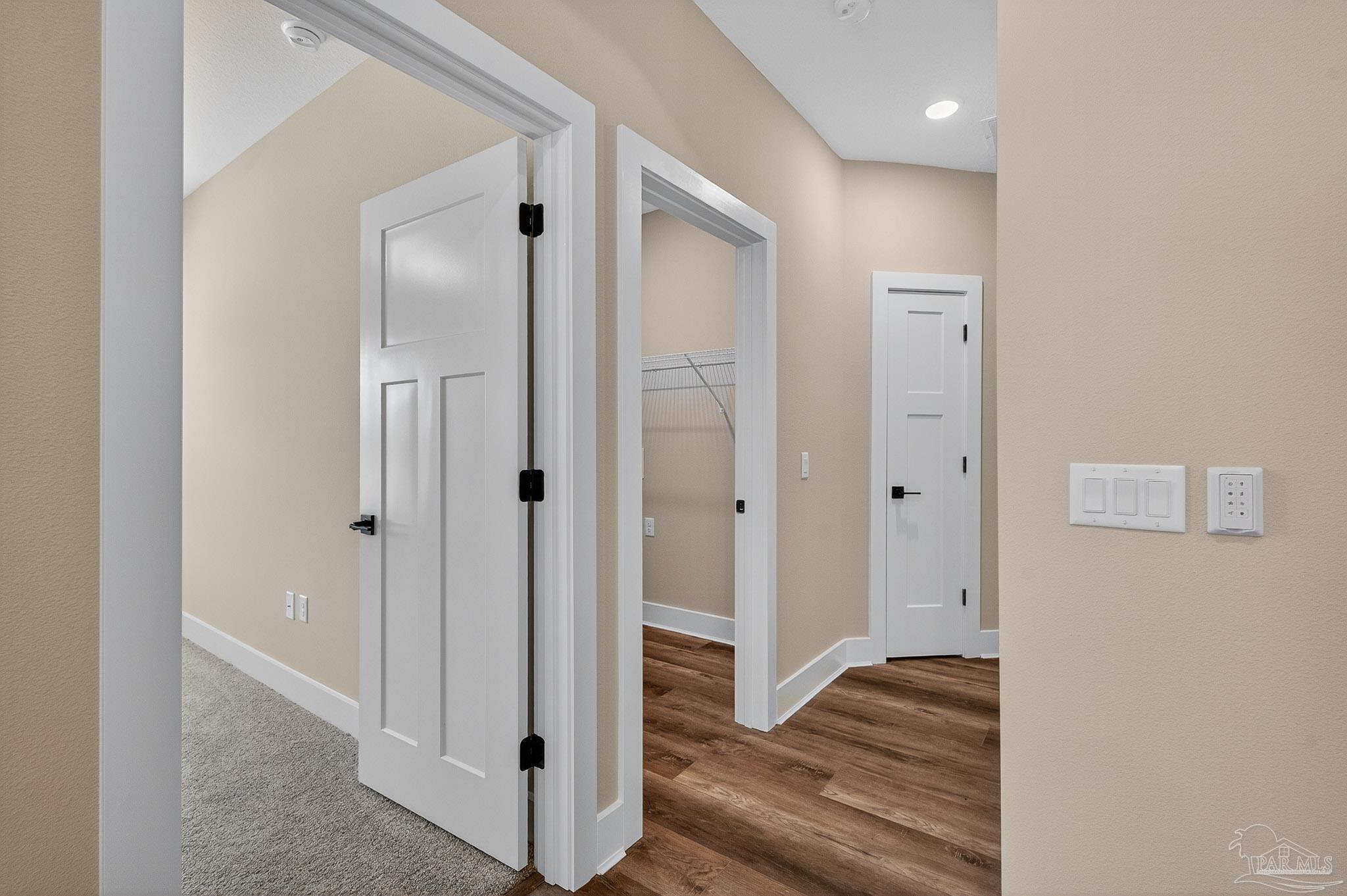 205 Webb Street Cantonment, FL 32533 - Photo 26 of 49 a view of a hallway with wooden floor and closet