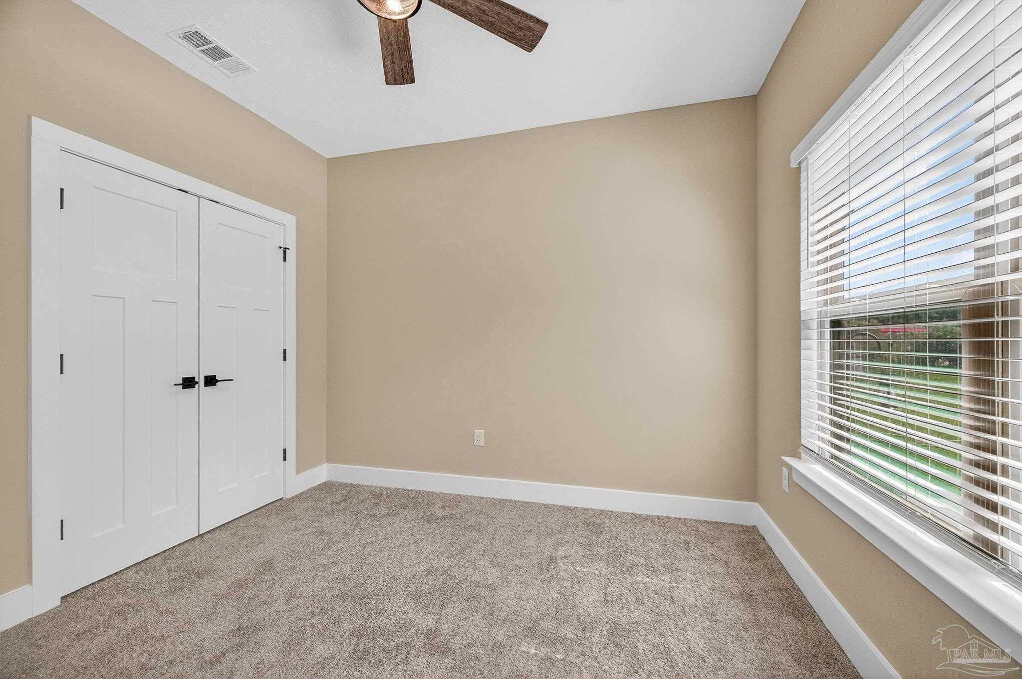 205 Webb Street Cantonment, FL 32533 - Photo 28 of 49 a view of an empty room with a window