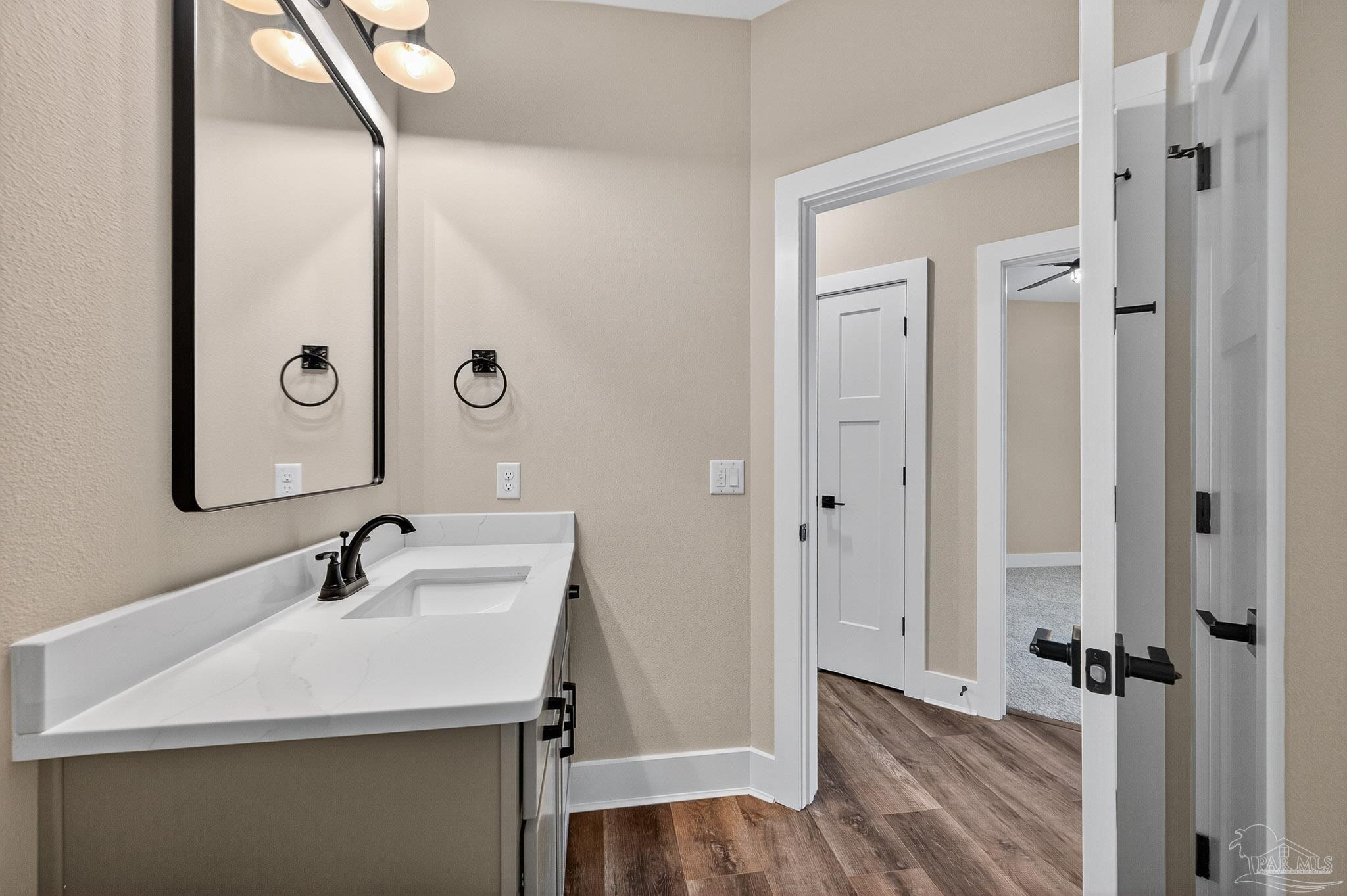 205 Webb Street Cantonment, FL 32533 - Photo 36 of 49 a bathroom with a sink and a mirror