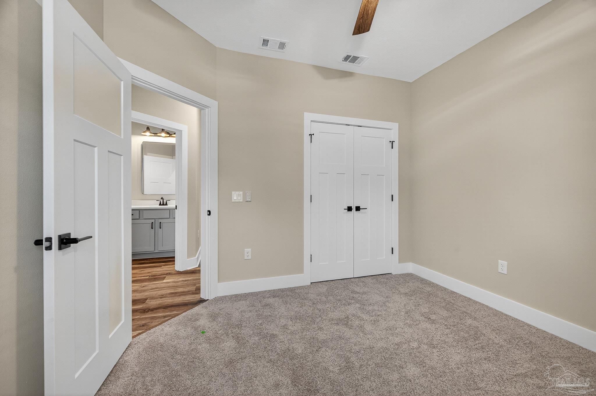 205 Webb Street Cantonment, FL 32533 - Photo 38 of 49 wooden floor and closet in a room
