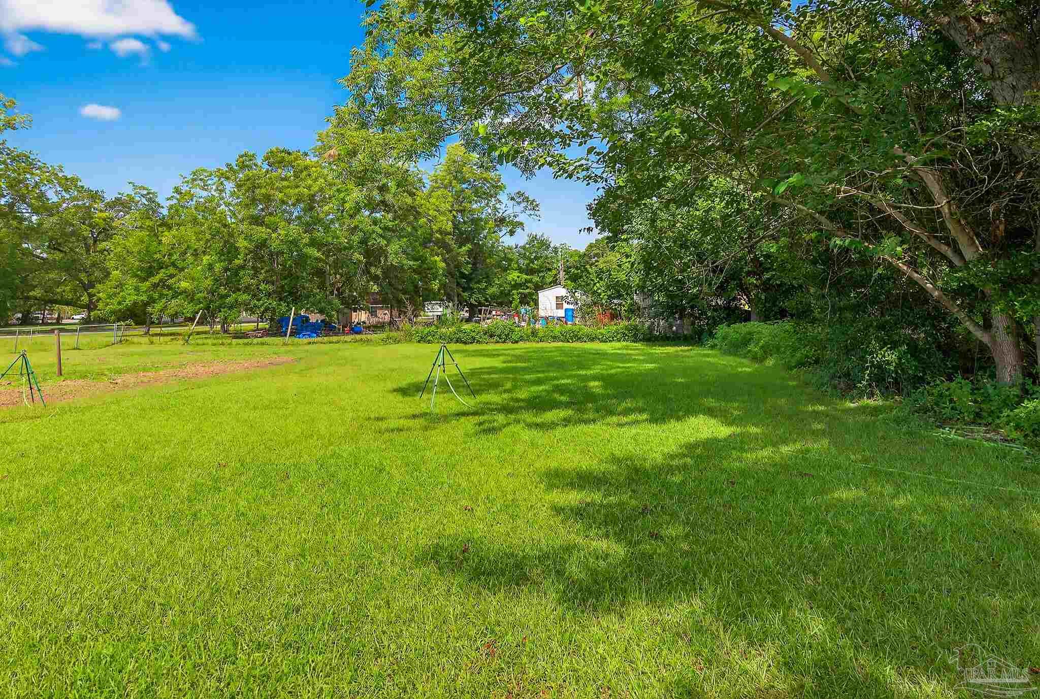 205 Webb Street Cantonment, FL 32533 - Photo 42 of 49 a view of a golf course with green space