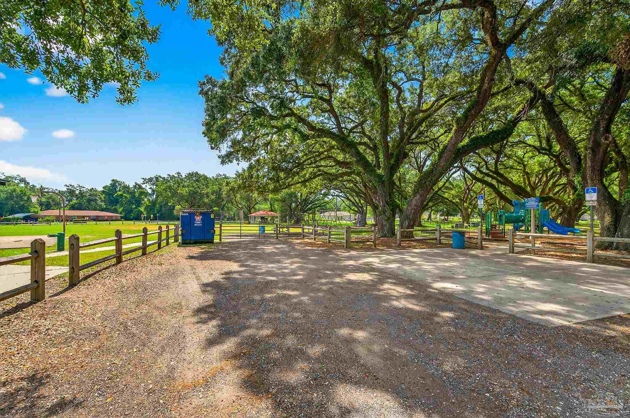 205 Webb Street Cantonment, FL 32533 - Photo 45 of 49 a view of a street with a trees