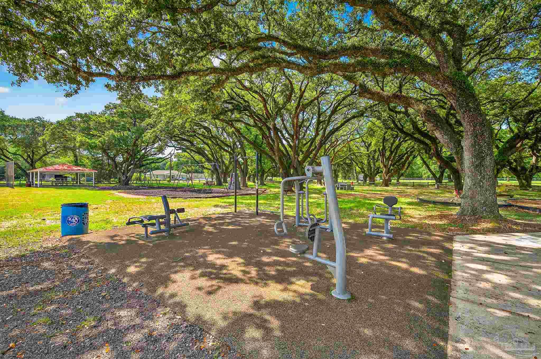 205 Webb Street Cantonment, FL 32533 - Photo 48 of 49 a view of a swimming pool with a patio