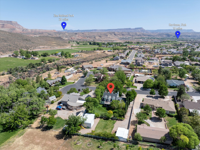 246 West Mount Charm Road Toquerville, UT 84774 - Photo 67 of 70 Aerial perspective of suburban area featuring mountains