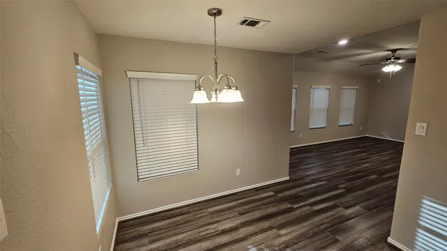 a kitchen with sink refrigerator and microwave