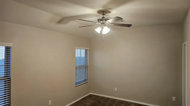 a view of a chandelier fan in a room