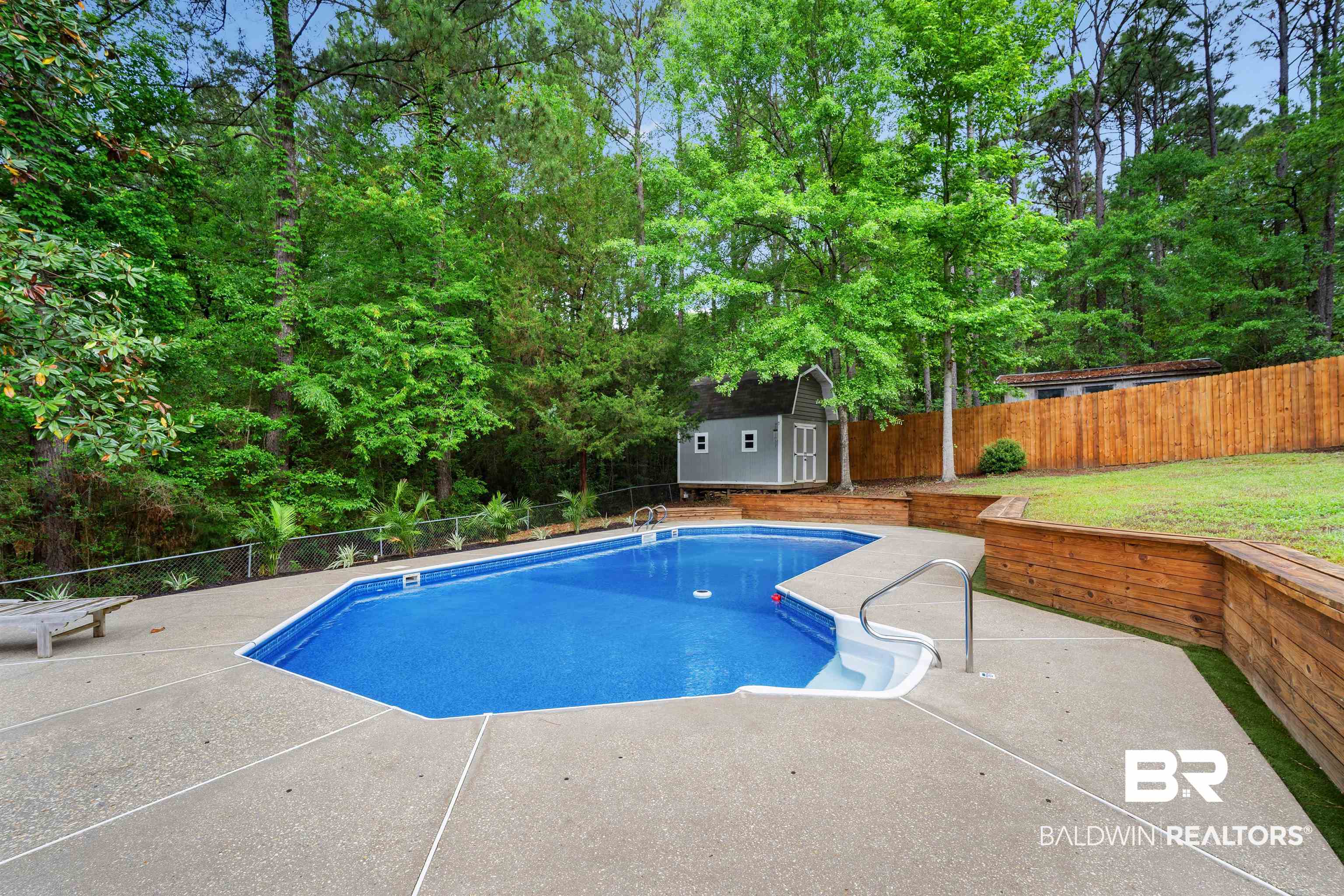 71 Caisson Trace Daphne, AL 36527 - Photo 29 of 36 In-ground swimming pool with concrete surround