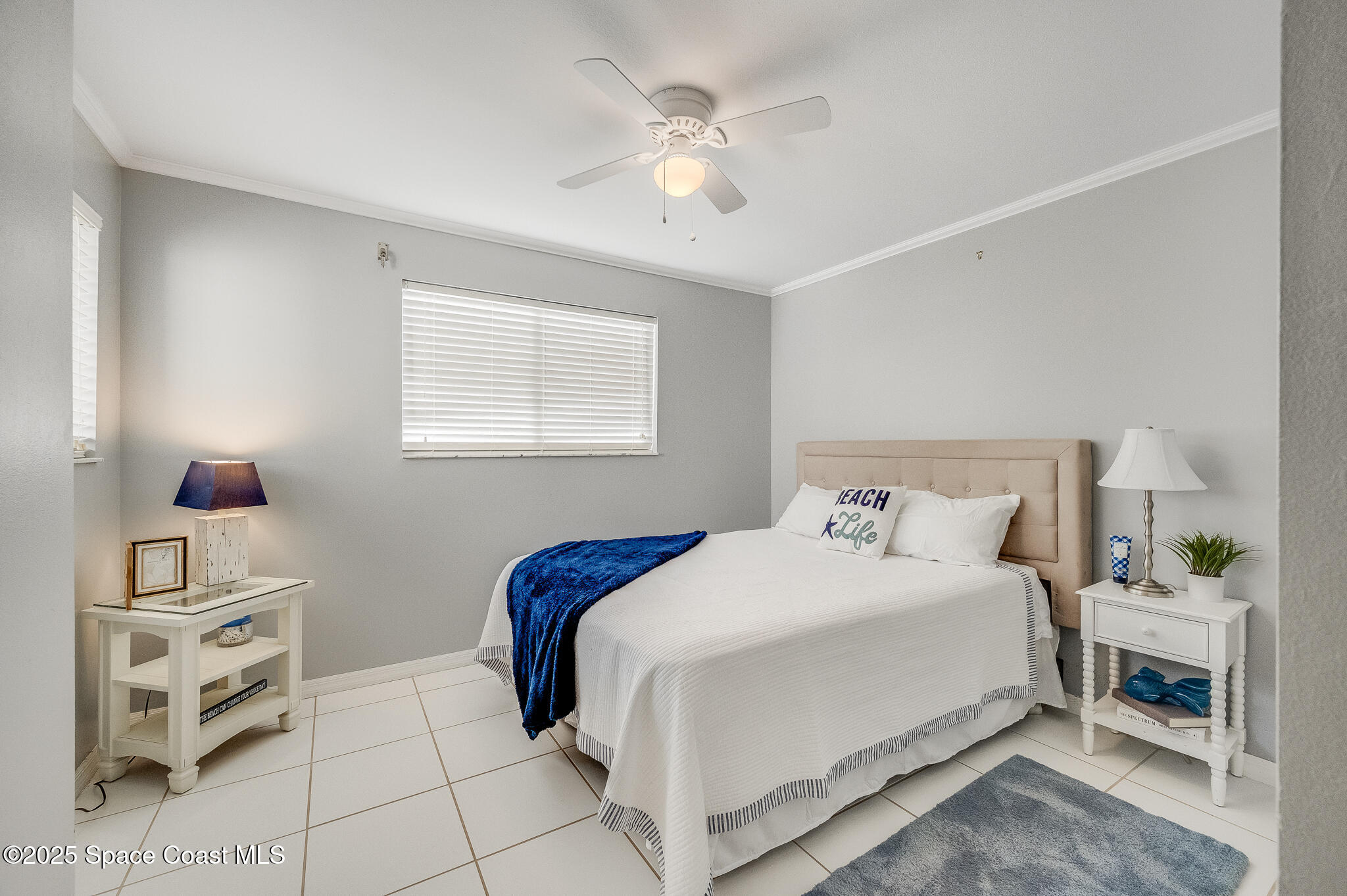 3319 Kirkland Road Northeast Palm Bay, FL 32905 - Photo 14 of 50 a bedroom with a large bed and a chandelier fan