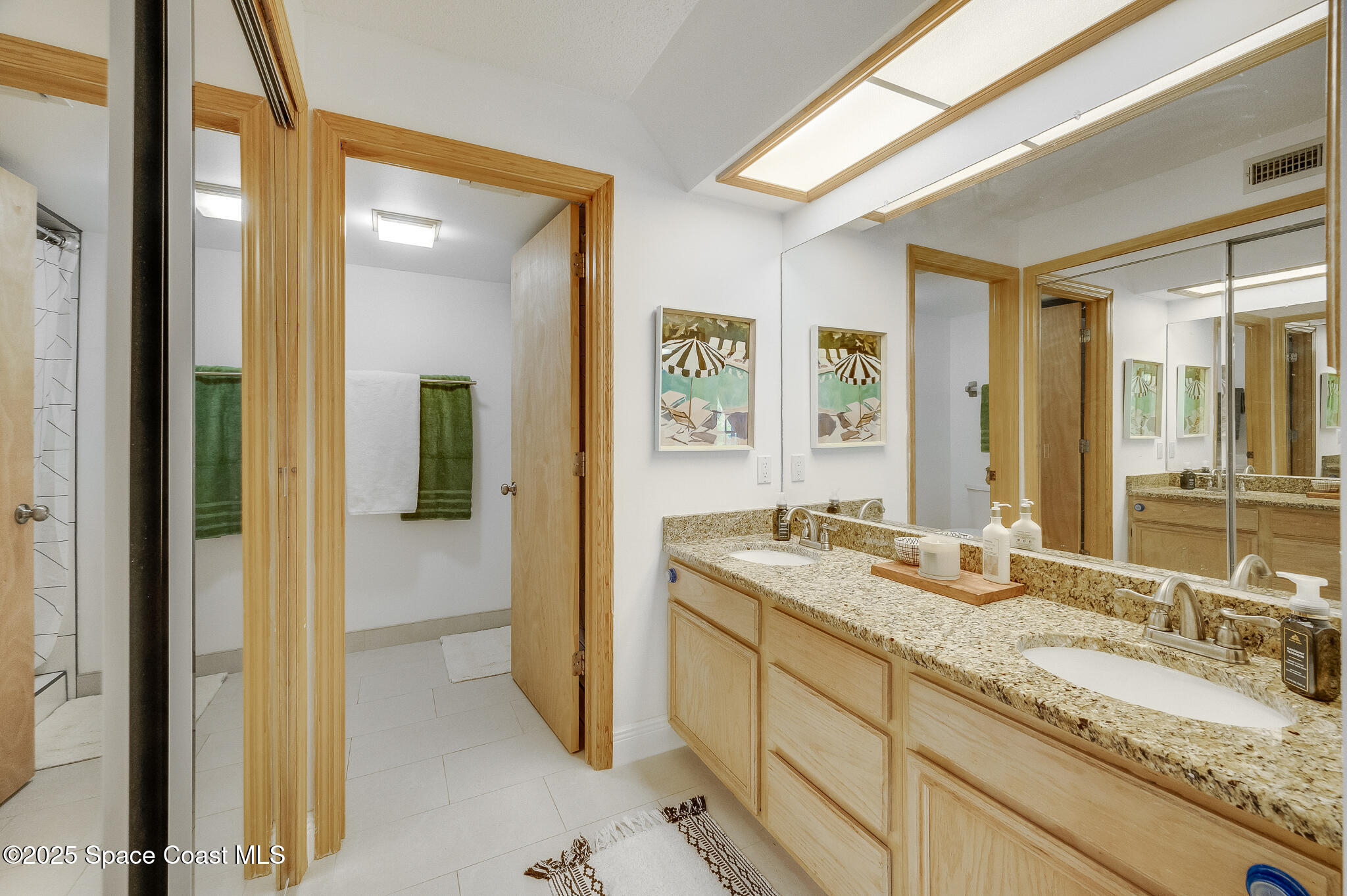 3319 Kirkland Road Northeast Palm Bay, FL 32905 - Photo 16 of 50 a bathroom with a granite countertop sink mirror and double