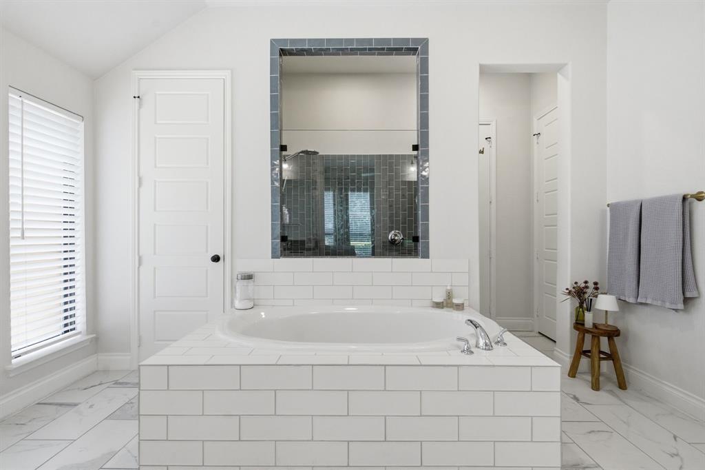 904 Fallbrook Avenue Denton, TX 76210 - Photo 20 of 30 a spacious bathroom with bathtub and shower