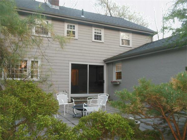 104 Kendall Road Lexington, MA 02421 - Photo 3 of 10 a backyard of a house with table and chairs