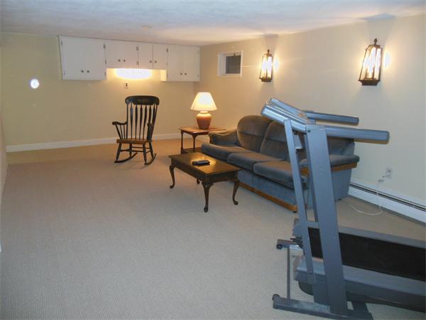 104 Kendall Road Lexington, MA 02421 - Photo 7 of 10 a living room with furniture and a lamp