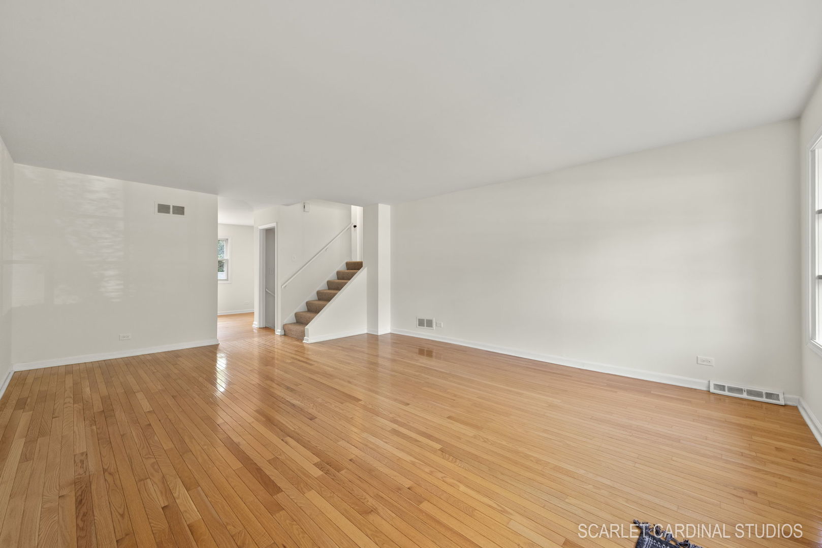 819 Delles Road Wheaton, IL 60189 - Photo 4 of 28 a view of an empty room with wooden floor and stairs