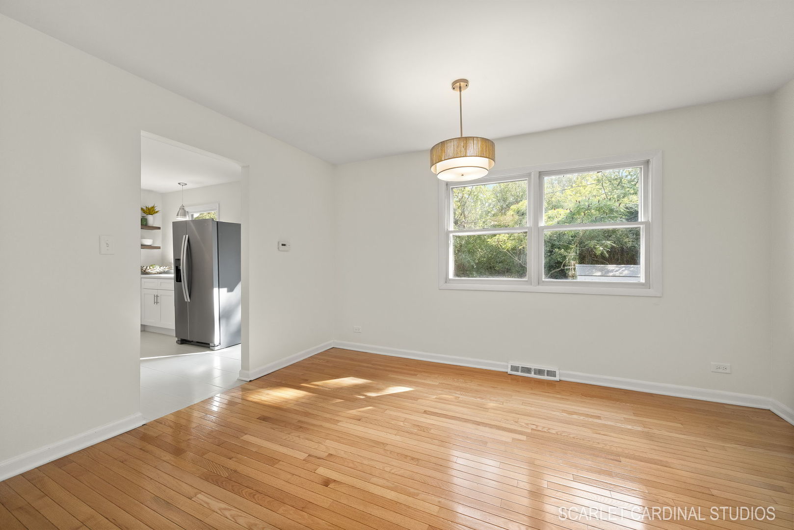 819 Delles Road Wheaton, IL 60189 - Photo 6 of 28 wooden floor in an empty room with a window