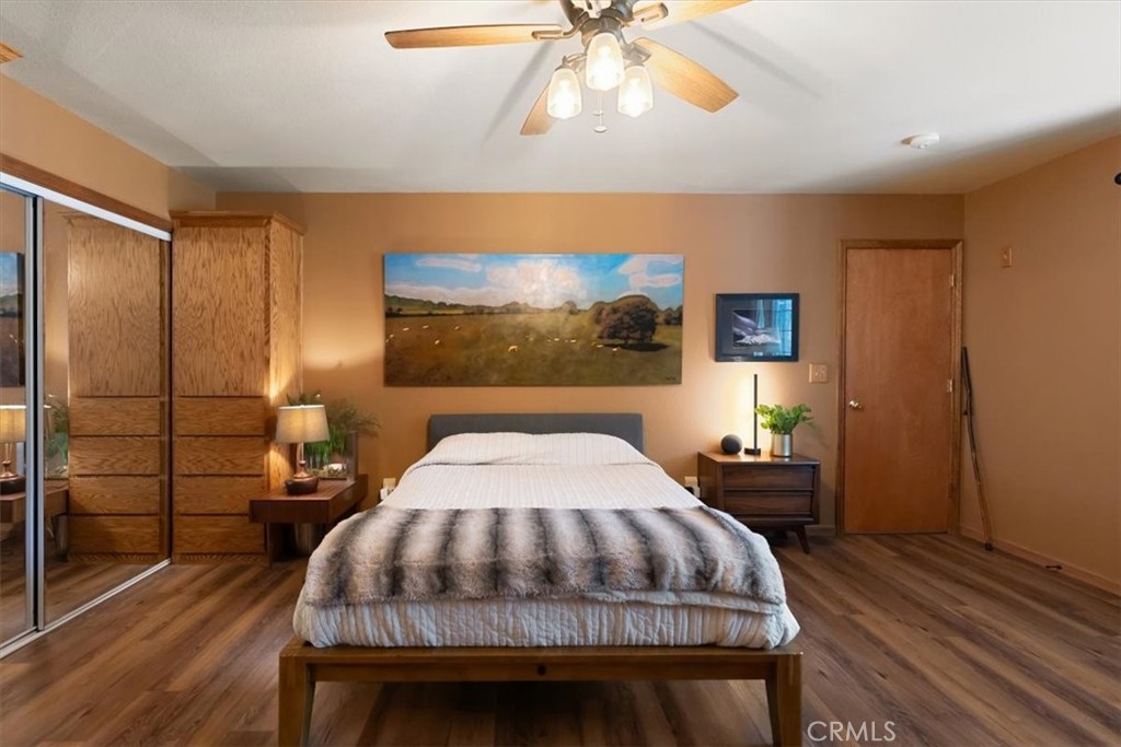 1533 West A Barr Road Mount Shasta, CA 96067 - Photo 15 of 38 a bedroom with a bed and a chandelier