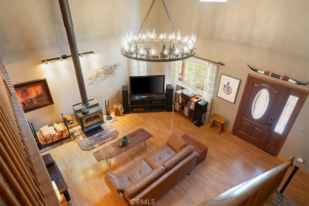 1533 West A Barr Road Mount Shasta, CA 96067 - Photo 23 of 38 a view of a dining room with furniture a chandelier and wooden floor