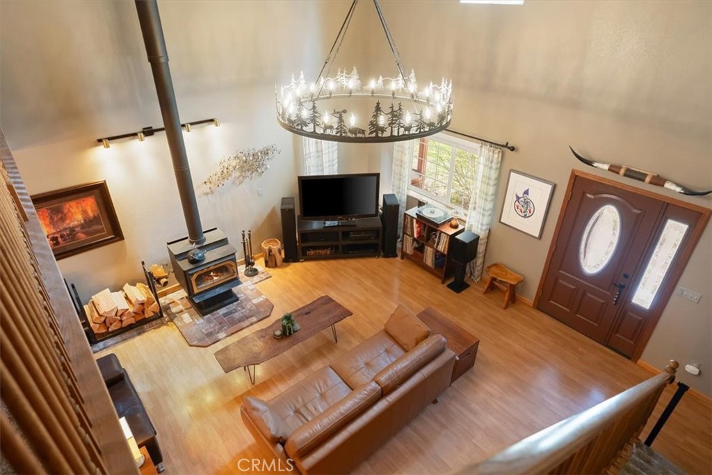 1533 West A Barr Road Mount Shasta, CA 96067 - Photo 24 of 38 a view of a dining room with furniture a chandelier and wooden floor
