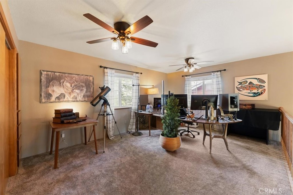 1533 West A Barr Road Mount Shasta, CA 96067 - Photo 25 of 38 a work room with furniture and a flat screen tv