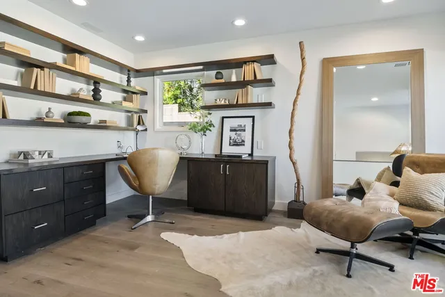 a bathroom with a double vanity sink toilet and a mirror