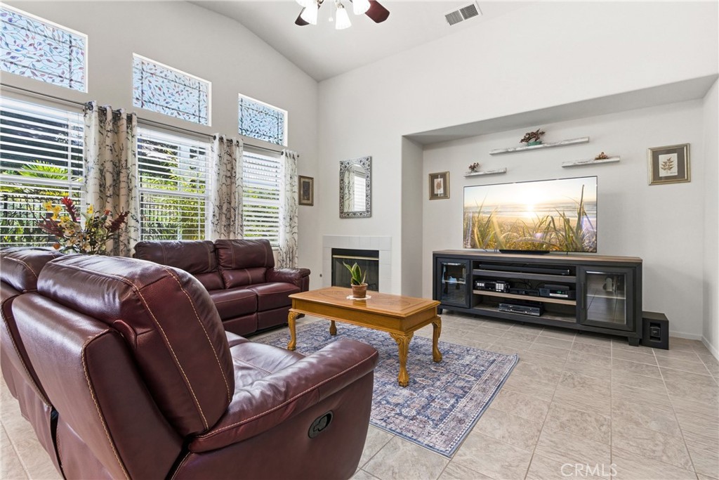 33145 Vermont Road Temecula, CA 92592 - Photo 12 of 41 a living room with furniture a flat screen tv and a window