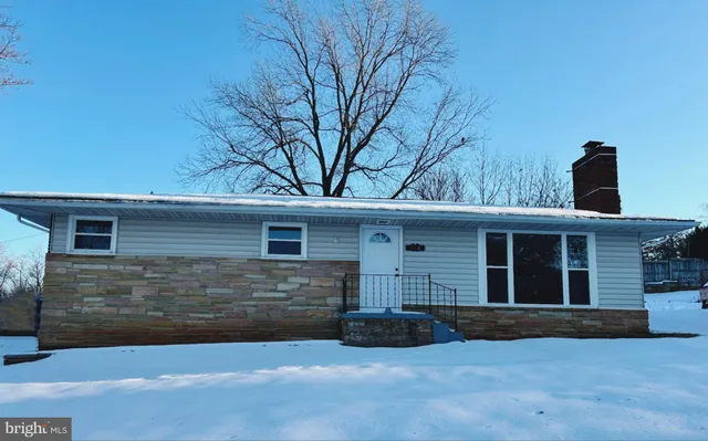a front view of a house with yard