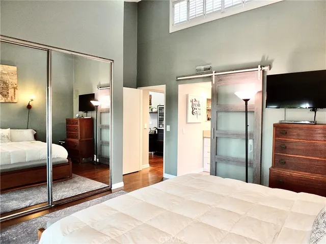 a bathroom with a double vanity sink a toilet and a mirror