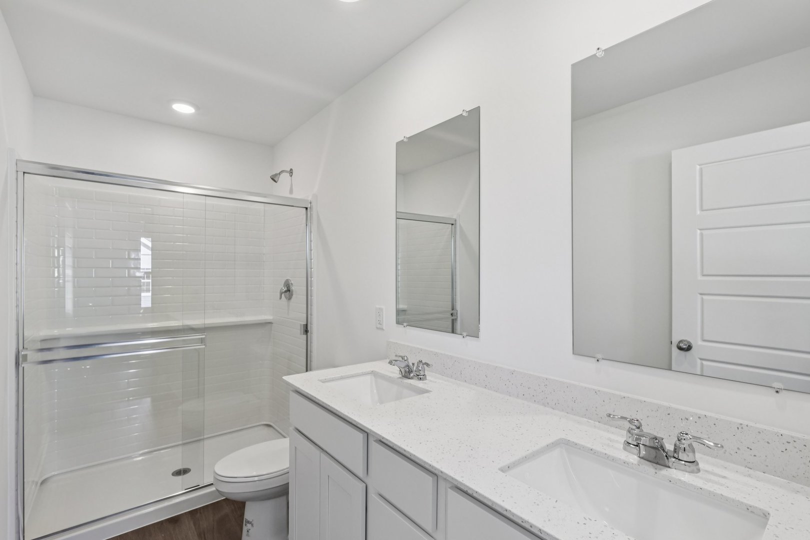1435 Oakfield Lane Pingree Grove, IL 60140 - Photo 13 of 60 a bathroom with a sink toilet a mirror and shower