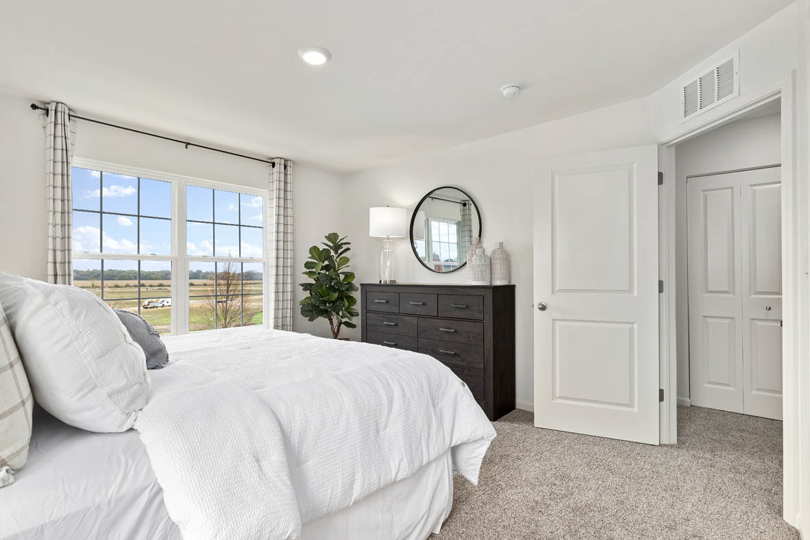 1435 Oakfield Lane Pingree Grove, IL 60140 - Photo 39 of 60 a bed sitting in a spacious bedroom next to a window