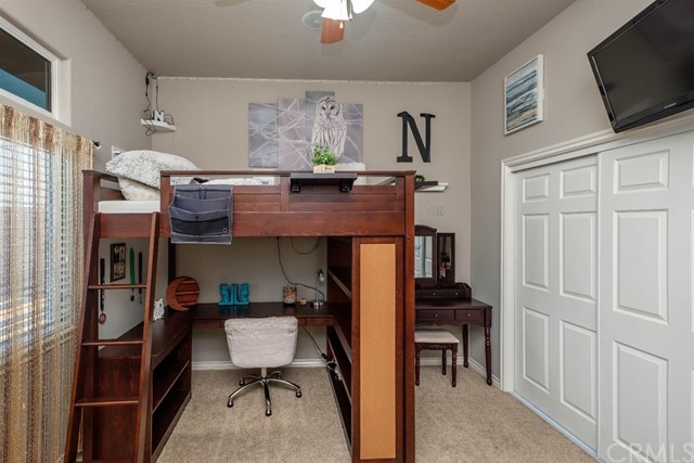 19286 Kanbridge Street Apple Valley, CA 92308 - Photo 11 of 37 a room with furniture and flat screen tv