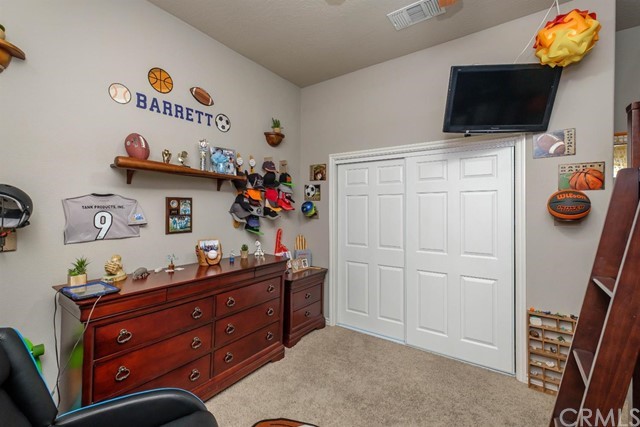 19286 Kanbridge Street Apple Valley, CA 92308 - Photo 12 of 37 a room with furniture and flat screen tv