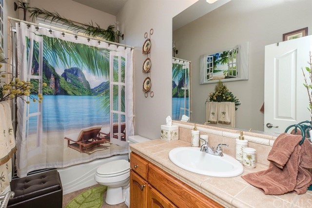 19286 Kanbridge Street Apple Valley, CA 92308 - Photo 13 of 37 a bathroom with a sink toilet and shower