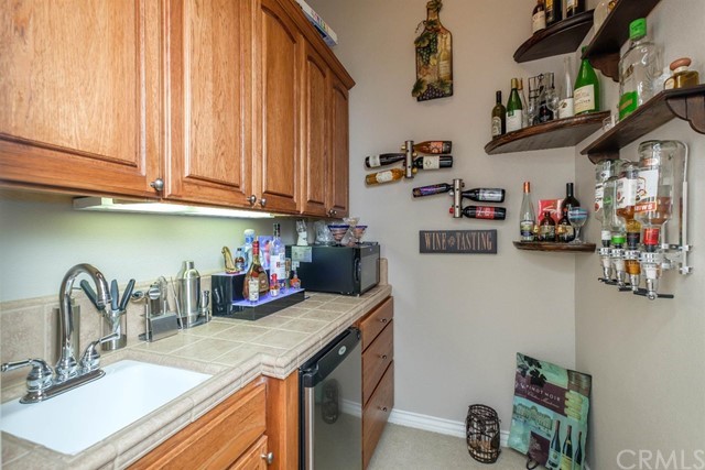 19286 Kanbridge Street Apple Valley, CA 92308 - Photo 20 of 37 a kitchen with a sink and cabinets