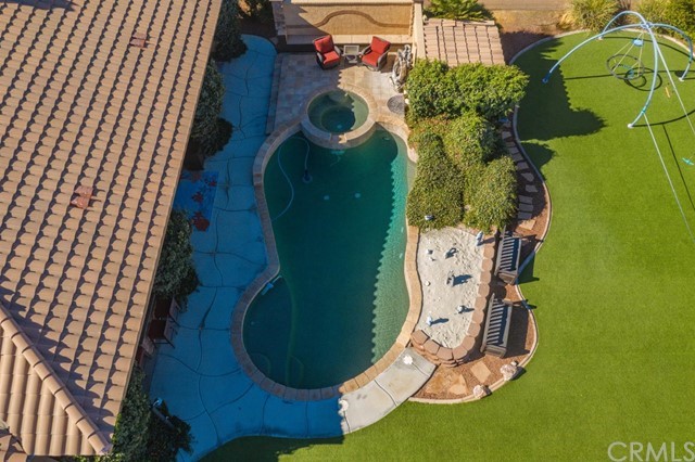 19286 Kanbridge Street Apple Valley, CA 92308 - Photo 23 of 37 an aerial view of a house with swimming pool and garden