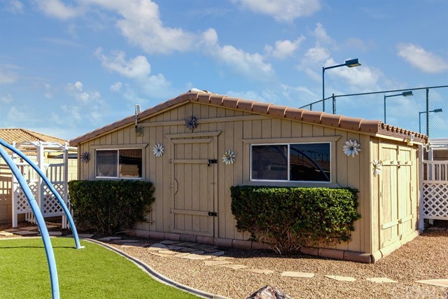 19286 Kanbridge Street Apple Valley, CA 92308 - Photo 28 of 37 a front view of a house with garden