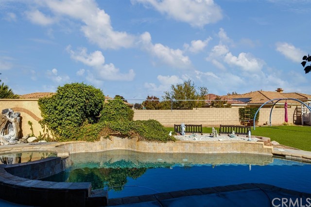 19286 Kanbridge Street Apple Valley, CA 92308 - Photo 29 of 37 a view of a swimming pool with an outdoor seating