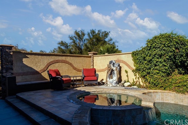 19286 Kanbridge Street Apple Valley, CA 92308 - Photo 30 of 37 swimming pool view with sitting space and garden in the background