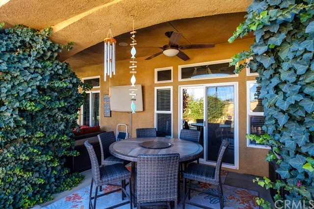 19286 Kanbridge Street Apple Valley, CA 92308 - Photo 34 of 37 a view of a dining table and chairs in the patio