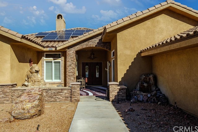 19286 Kanbridge Street Apple Valley, CA 92308 - Photo 36 of 37 a front view of a house with garden