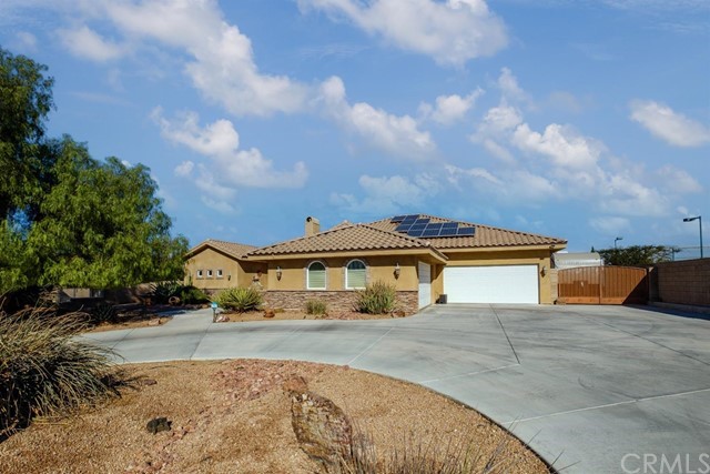 19286 Kanbridge Street Apple Valley, CA 92308 - Photo 37 of 37 a front view of a house with a yard