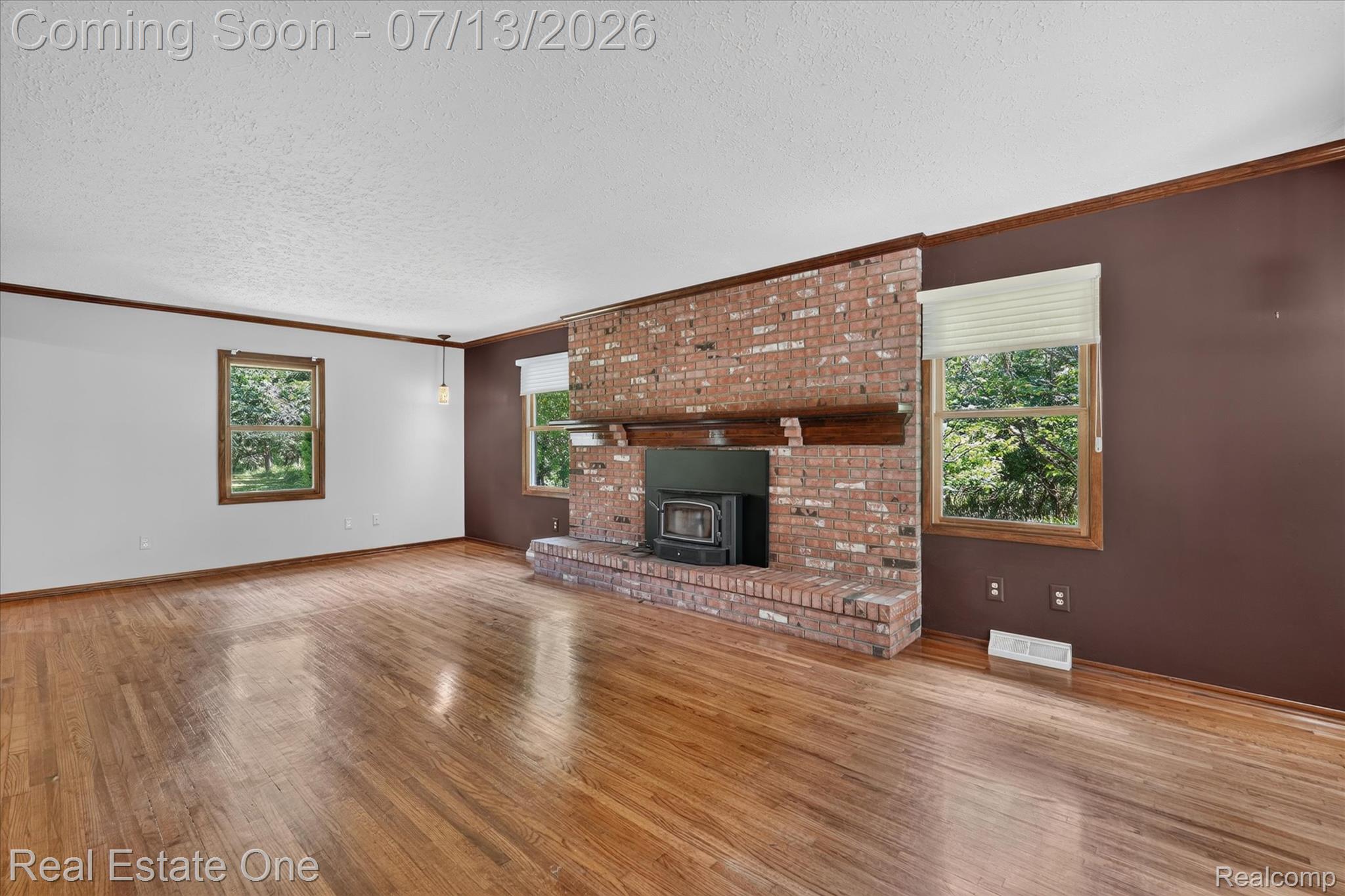 6039 Fish Lake Road Holly, MI 48442 - Photo 6 of 70 Original freshly stained hard wood floors Beautiful stone fireplace surrounding a Regency wood burning Fireplace. Hunter Douglas Blinds throughout.