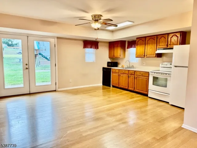 a kitchen with stainless steel appliances granite countertop a stove and a sink