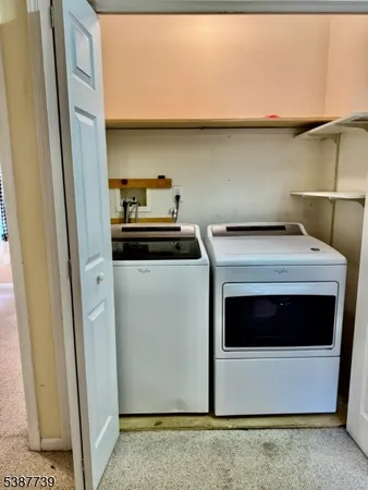 a utility room with washer and dryer