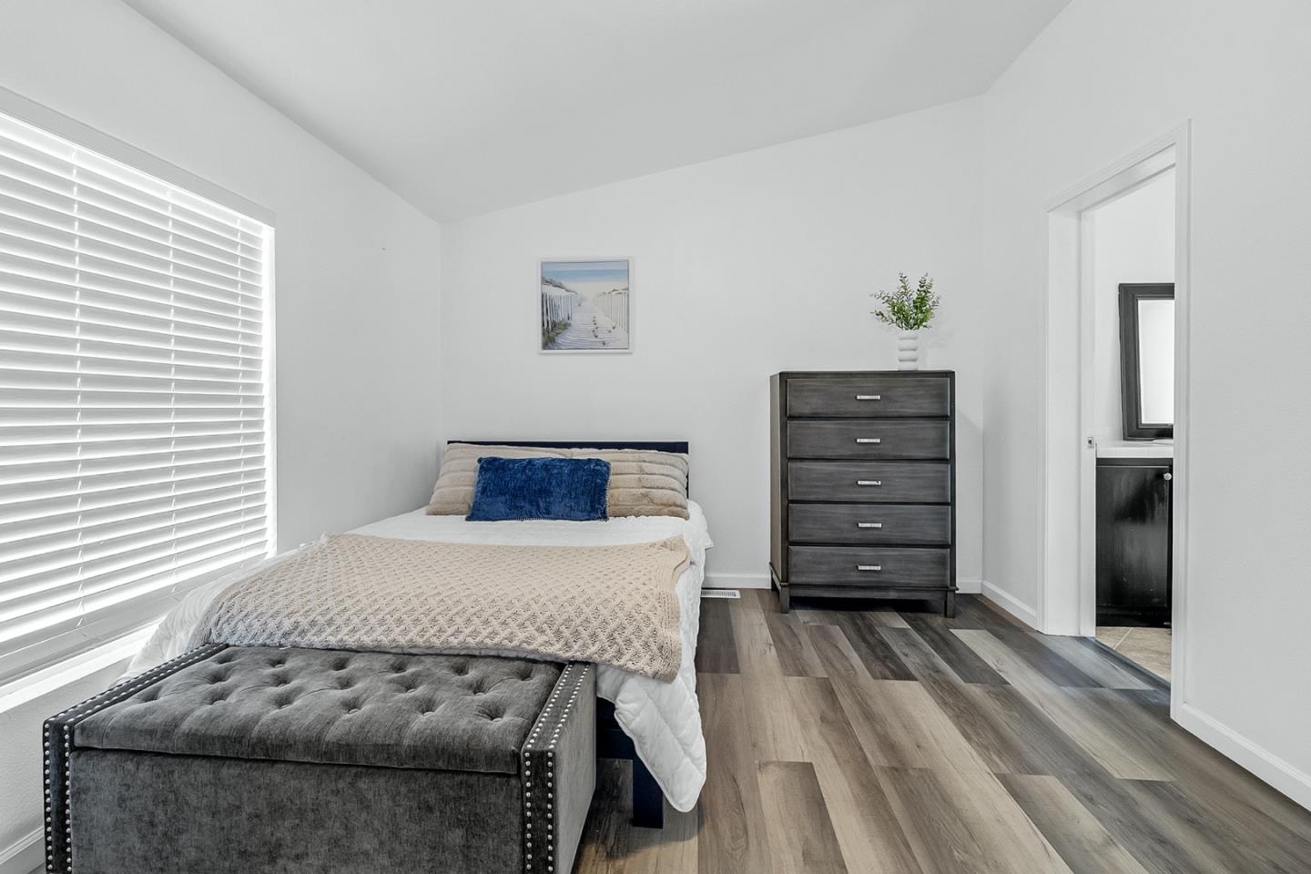 1900 Highway 1, Unit 62 Moss Landing, CA 95039 - Photo 13 of 21 a bedroom with a bed and a dresser